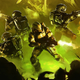 A group of armored soldiers fire assault rifles into a crowd of enemies.